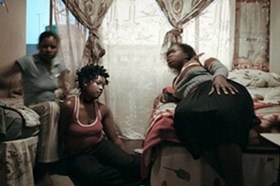 Tshililo (right) and her friends share a one-roomed apartment in Cape Agulhas Esselen Street, Hillbrow