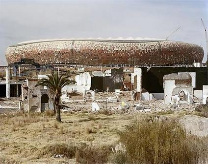 The ruins of Shareworld and FNB-Soccer City Stadium. Shareworld, intended as a theme-park to the people of Soweto, was built and went bankrupt in the late 1980s
