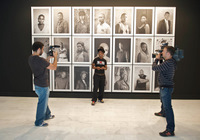 Zanele Muholi poses in front of her Faces and Phases portraits at a press conference prior to the opening of her solo exhibition at Casa Africa in Las Palmas, Canary Islands